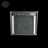 A black and gray Peavey Special 150 guitar amplifier against a solid black background, featuring a textured gray front grille, control knobs, and a white Peavey logo.