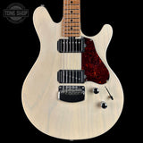 Electric guitar with a white pickguard and red flame maple top on a black background, featuring the Tone Shop logo.