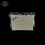Fender Deluxe Ace 100W guitar amplifier with a cream-colored grille cloth and black control panel, shown against a solid black background.