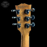 Guitar headstock with tuning pegs on a black background, featuring 'Tone Shop' logo.