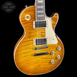 Electric guitar with a sunburst finish on a black background, featuring the Tone Shop logo.