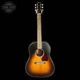 Acoustic guitar with a sunburst finish on a black background, featuring the Gibson logo.
