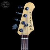 Guitar headstock with 'Lakeland' branding on a black background