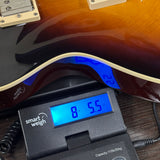 Used Eastman SB59 Sunburst on scale displaying weight.