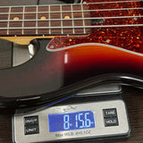 Guitar on a digital scale displaying weight