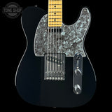 A black electric guitar with a glossy black body, a silver mother-of-pearl pickguard, and a natural maple neck, shown against a solid black background.