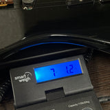 Used ESP LTD MIJ Black on scale displaying weight.