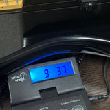 Used Fender Squier II P-Bass Black on scale displaying weight.