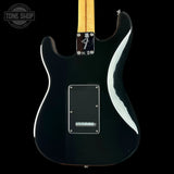 Fender electric guitar body in glossy black with a maple neck, shown from the back against a black background. A Tone Shop watermark is visible in the top left corner.
