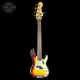 A classic four-string electric bass guitar with a sunburst finish, cream pickguard, and maple headstock, shown vertically against a solid black background. A Tone Shop watermark is visible in the top-left corner.