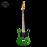 A green Fender Telecaster electric guitar with a black pickguard and maple neck, shown against a solid black background with a Tone Shop watermark in the top-left corner.