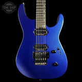 A blue metallic electric guitar with black hardware, shown from the front against a solid black background. A Tone Shop watermark is visible in the top-left corner.