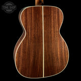 Back angle of Collings OM2 A HC Hill Country Sunburst Adirondack.