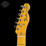 Fender Telecaster Custom headstock on a black background
