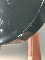 Close-up of a guitars surface with minor imperfections.
