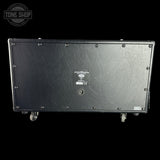 The rear view of a black EVH speaker cabinet on wheels, featuring a textured metal backplate with a central EVH logo plate and a Tone Shop watermark in the top left corner.
