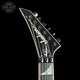 Guitar headstock with 'Jackson' branding on a black background