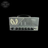 A Victory VX guitar amplifier head in dark gray metal with gold logo detailing and black control knobs, shown against a solid black background.