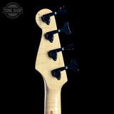 Guitar headstock with tuning pegs on a black background, featuring 'Tone Shop' logo.