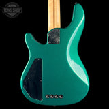 Green electric guitar with a black pickguard on a black background, featuring 'Tone Shop' branding.