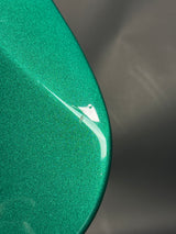 Close-up of a green surface with a scratch
