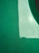 Close-up of green textured material with a white border