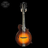 Mandolin with a glossy finish on a black background, featuring the Tone Shop logo.