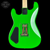 Green electric guitar with a visible brand logo in the corner