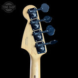 Guitar headstock with tuning pegs on a black background, featuring 'Tone Shop' logo.