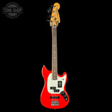 Red electric bass guitar on a black background with 'Tone Shop' logo.