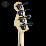 Guitar headstock with tuning pegs on a black background, featuring the Fender logo.