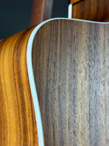 Wear on back of Used Taylor 210ce.