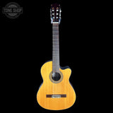 Acoustic guitar with a visible brand logo on a black background