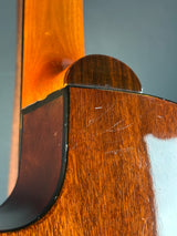 Close-up of a wooden object with a focus on texture and grain.