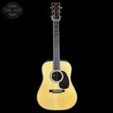 Acoustic guitar on a black background with 'Tone Shop' logo.