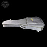 A gray fabric instrument case with a zippered top pocket featuring a yellow logo, shown against a solid black background. A 'TONE SHOP' watermark is visible in the top-left corner.