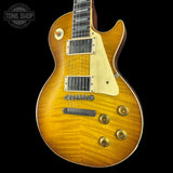 Electric guitar with a sunburst finish on a black background, featuring the Tone Shop logo.