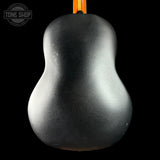 Black guitar pick with a pear shape on a black background, featuring 'Tone Shop' logo.