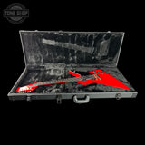 Red electric guitar in an open black case with 'Tone Shop' logo.