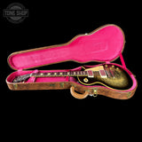 Gibson Les Paul guitar in a pink-lined case with 'Tone Shop' logo.