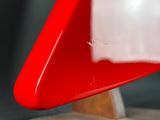 Close-up of a red and white object with a blurred background