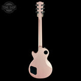 A single-cutaway electric guitar shown from the back, featuring a metallic rose gold finish and black hardware, set against a solid black background with a Tone Shop watermark in the top left corner.