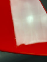 Close-up of a red and white object with a blurred background
