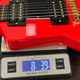 Red electric guitar on a digital scale displaying weight