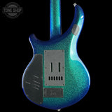 Blue and green glitter electric guitar on a black background with 'Tone Shop' logo.