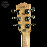 Back of headstock of Gibson Hummingbird Elegant Koa Left Handed Honey Burst.