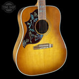 Front angle of Gibson Hummingbird Elegant Koa Left Handed Honey Burst.