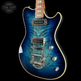 Blue electric guitar with a black background