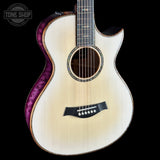 Acoustic guitar with purple accent on a black background, featuring the Tone Shop logo.