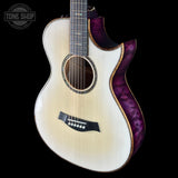 Acoustic guitar with purple swirl design on a black background, featuring the Tone Shop logo.